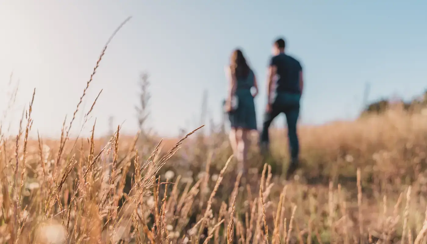 A couple in the background, walking together in nature
